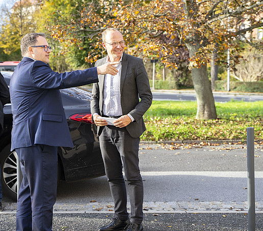 Rector and minister at the parking lot