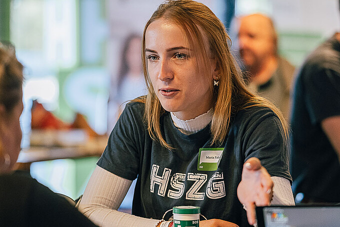 Staff member at the exhibition booth